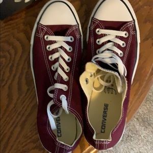 Maroon Converse sneakers